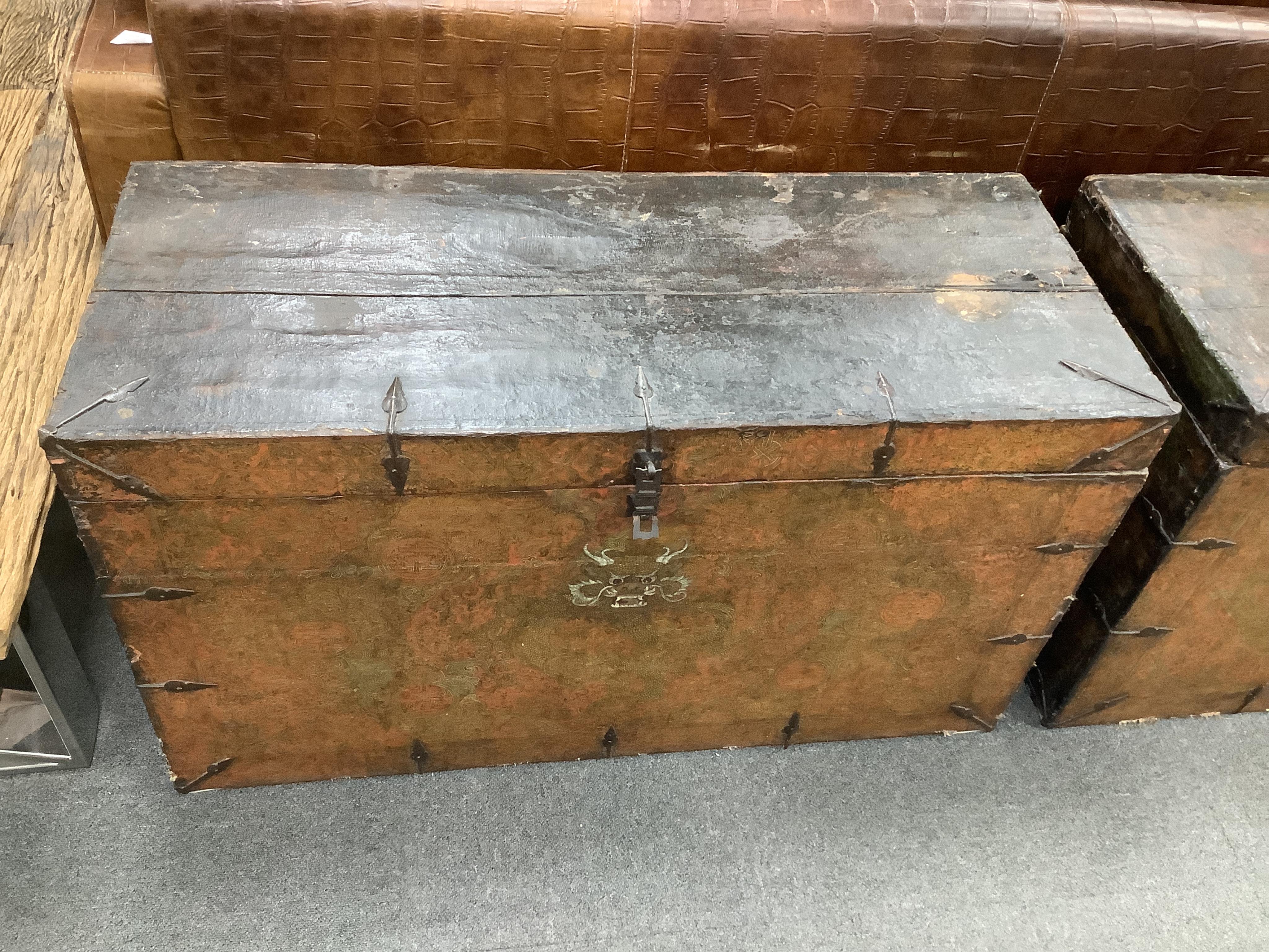 A pair of early 19th century Tibetan trunks, width 100cm, depth 42cm, height 57cm. Condition - poor